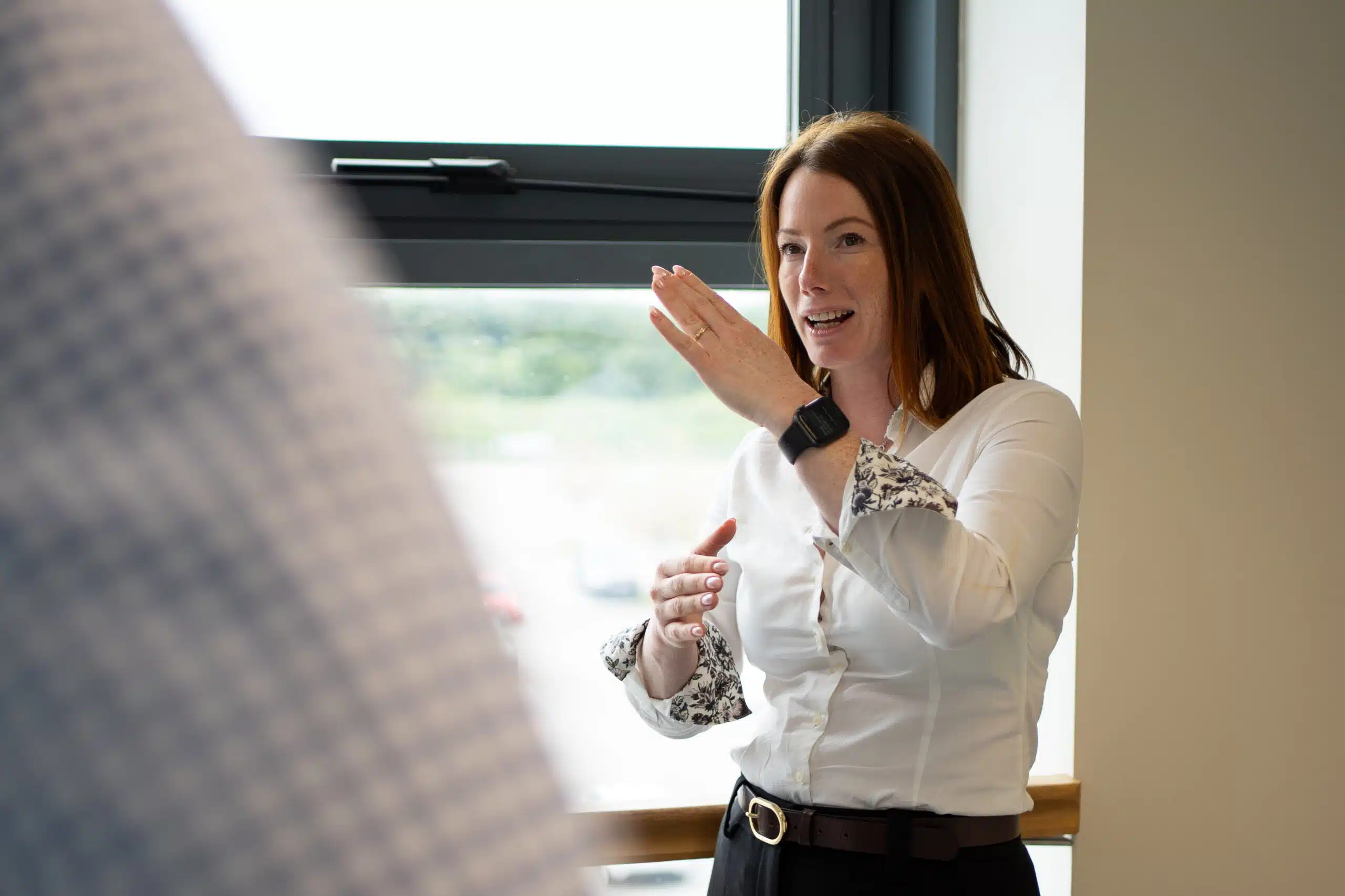 Emma from The Evacuation Company discussing evacuation equipment with a client | Access Audit