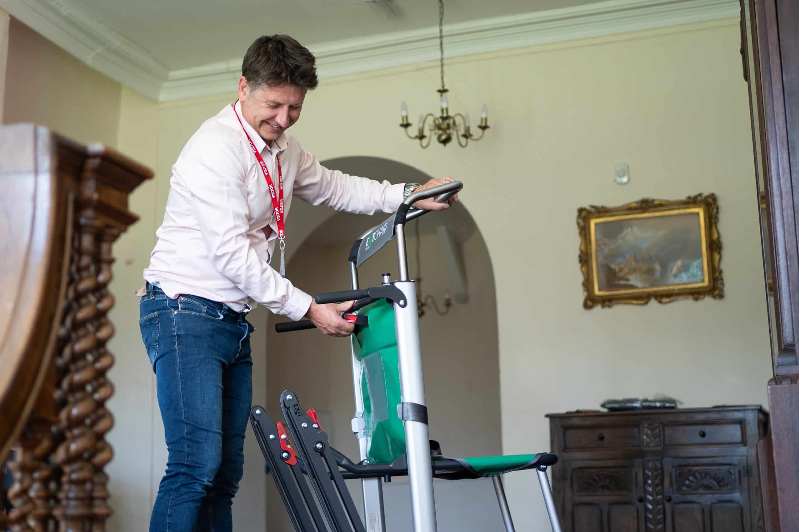 Chris from The Evacuation Company servicing an evacuation chair | Evacuation Equipment Servicing